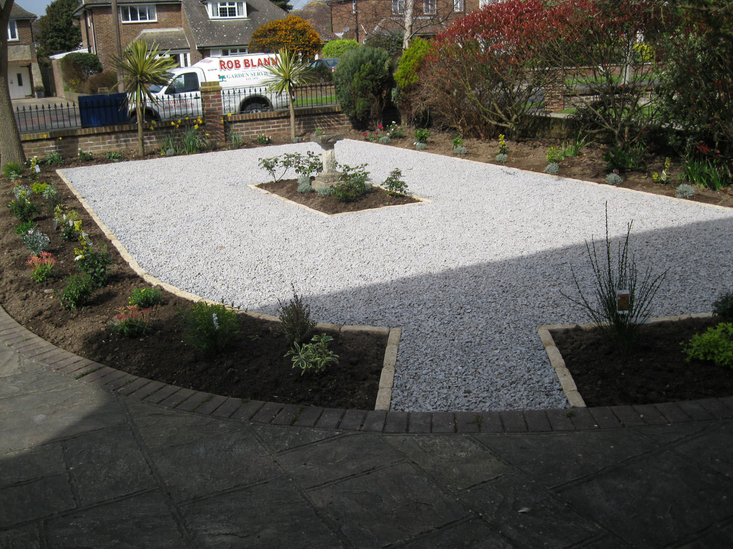 Landscaped front garden with stone chippings and new planting